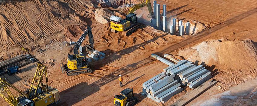 Machine moving dirt at job site.